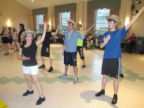 Choeographer Tammy Paulino works with the male dancers in the opening song rehearsal begins