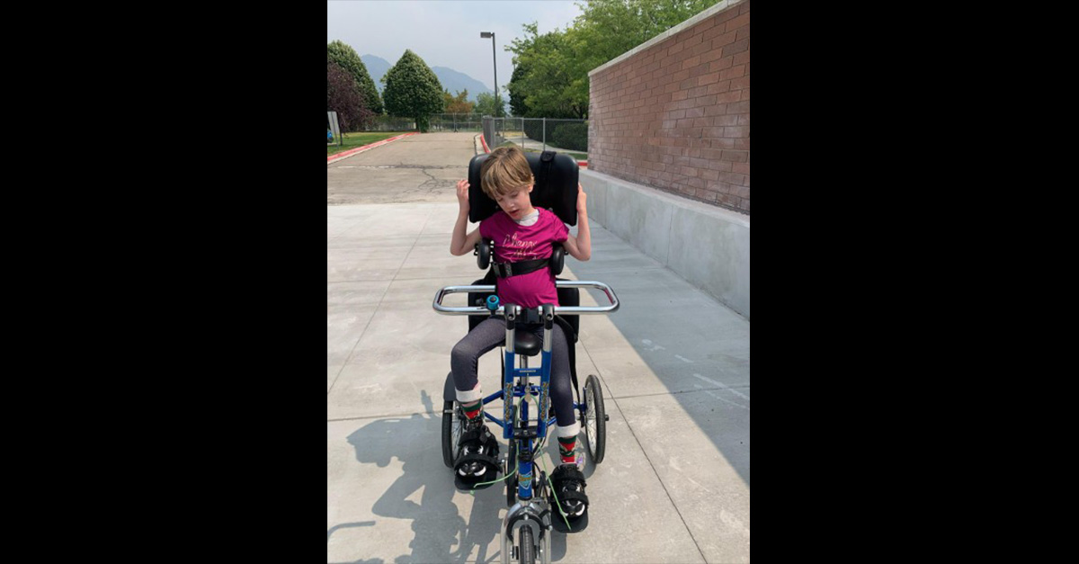 Jordan Valley students use sidewalk for adaptive tricycles Sandy Utah